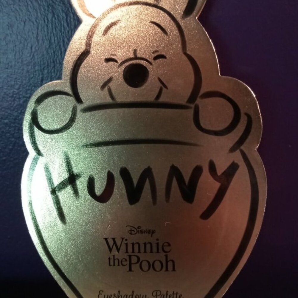 Winnie the Pooh Eyeshadow Palette in Gold Honey Pot Packaging.